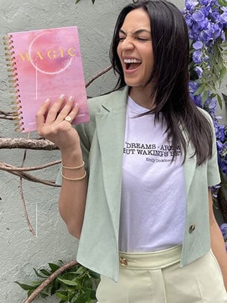 Natalee holding Magic Journal in hand